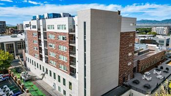 A large building with a parking lot in front of it.